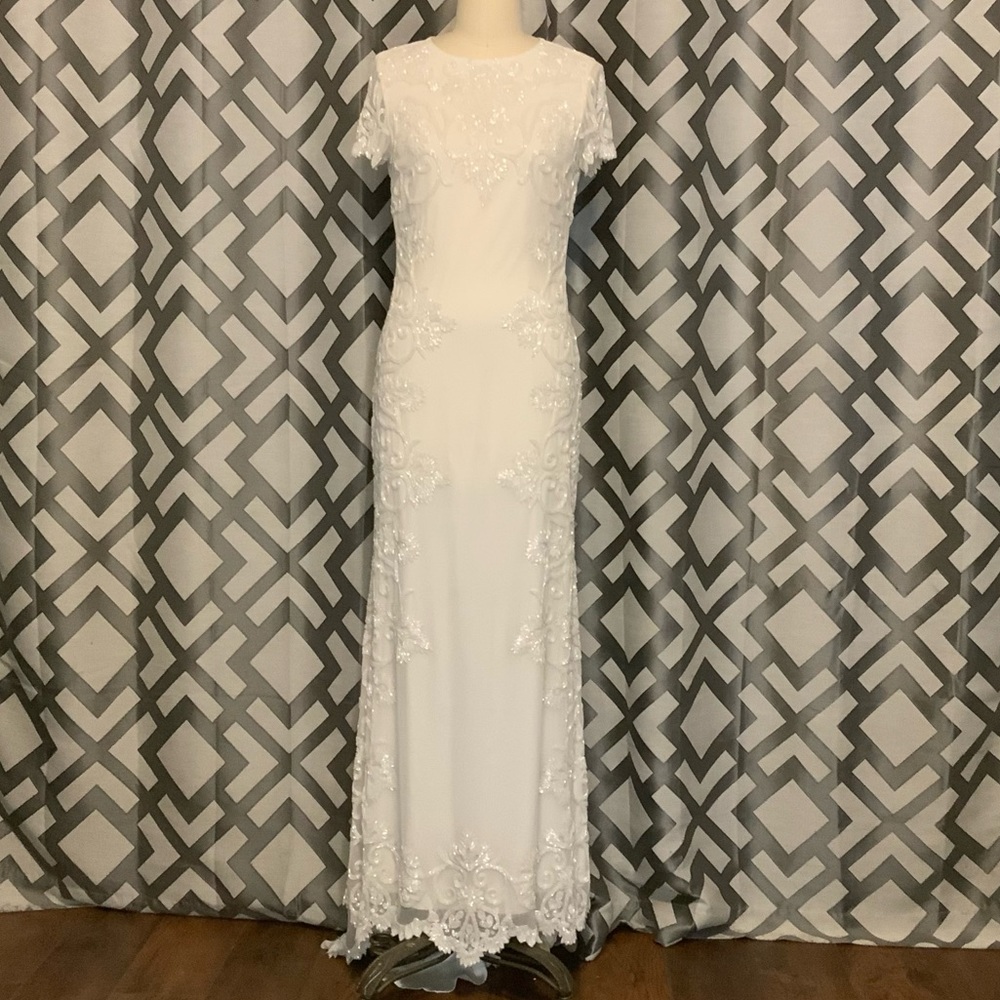 Fitted modest wedding dress like-new with tag.